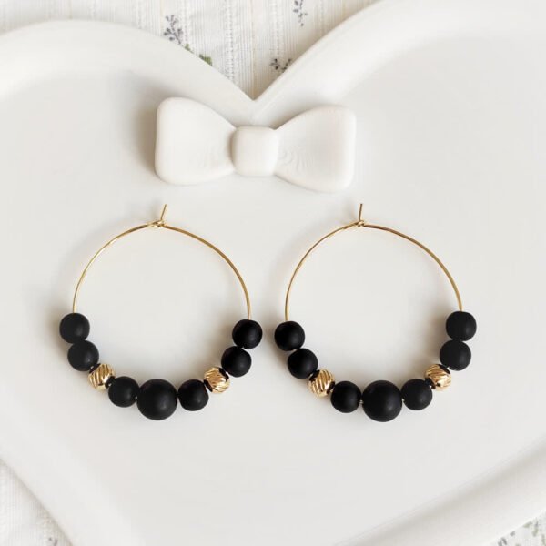boucles d'oreilles créoles noires et doré