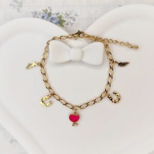 Bracelet doré avec breloques dorées breloque tulipe rose